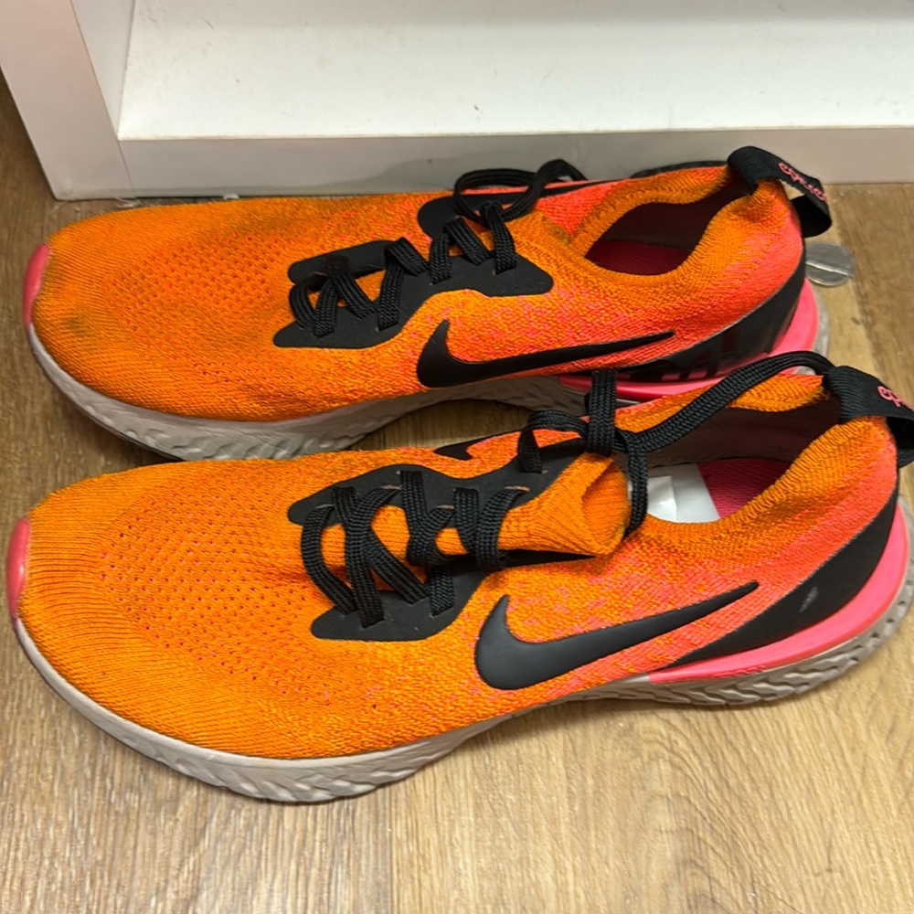 Orange and coral Nike epic react running shoes